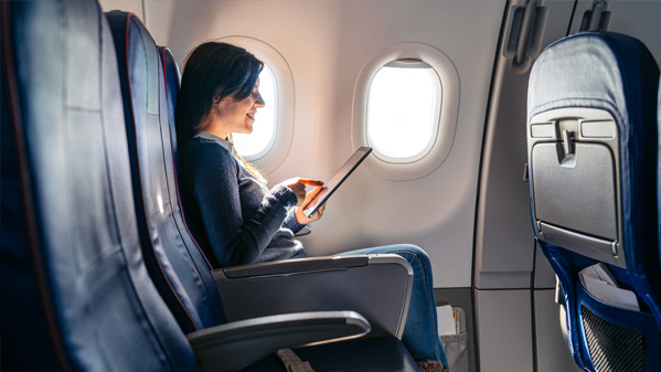 Business professional in airplane seat