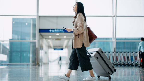 Woman walking through airport