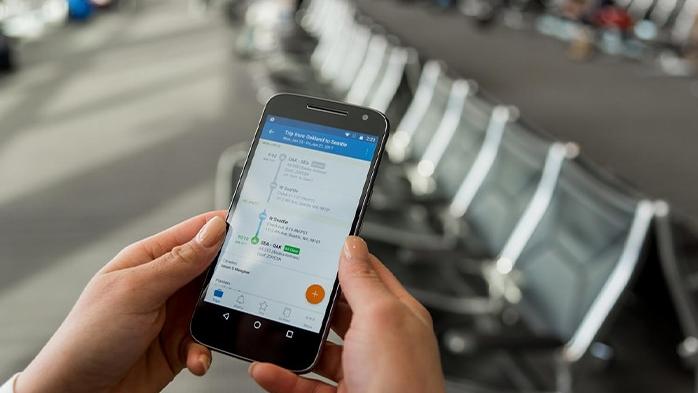 Person using phone in airport