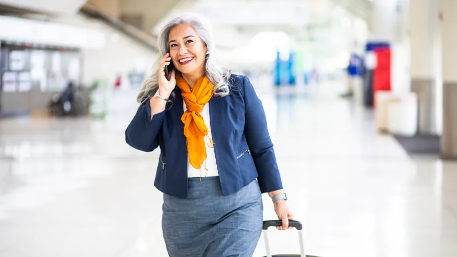 woman on the phone at the airport