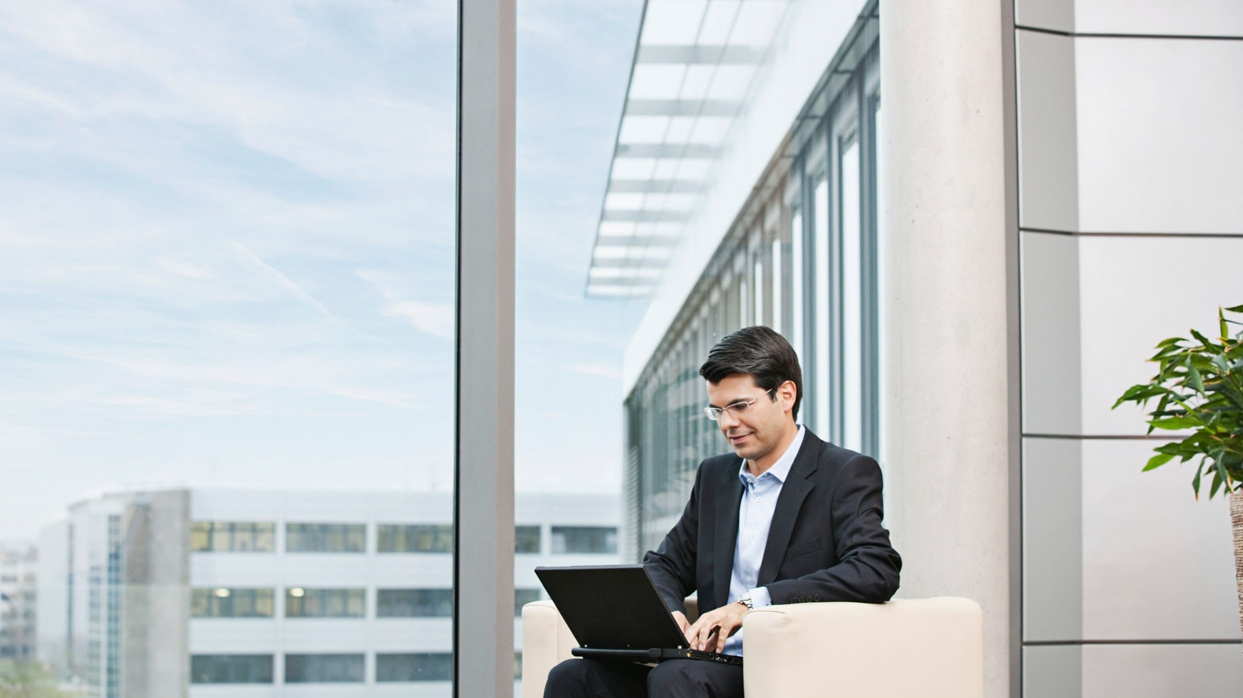man sitting outdoor with a computer