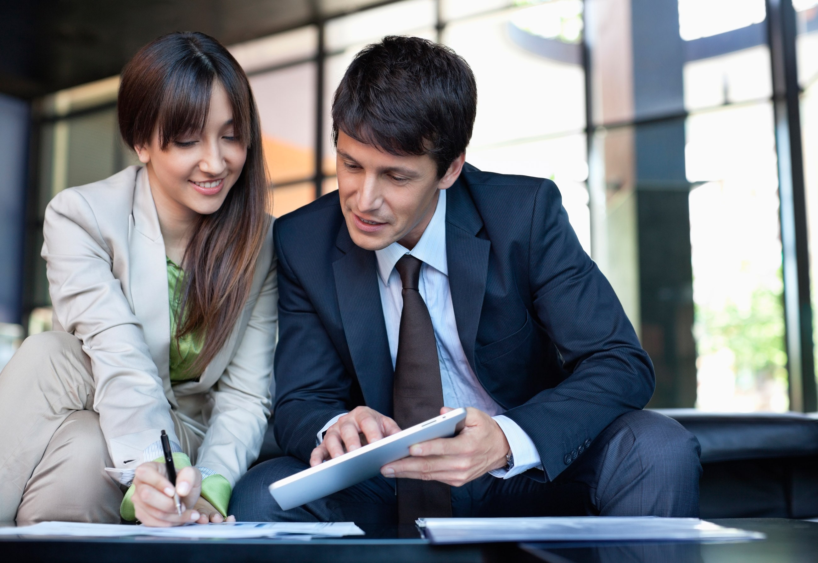 Two People checking papers