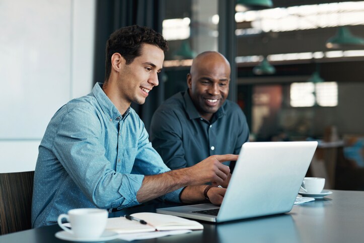 Two Finance People happy Laptop